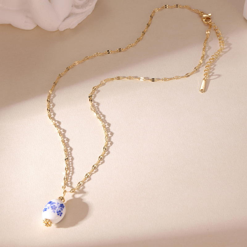 新しい中国風のレトロな青と白の磁器ペンダント女性の愛の花セラミックネックレスステンレス鋼チェーントランスボーダーホット販売卸売|undefined