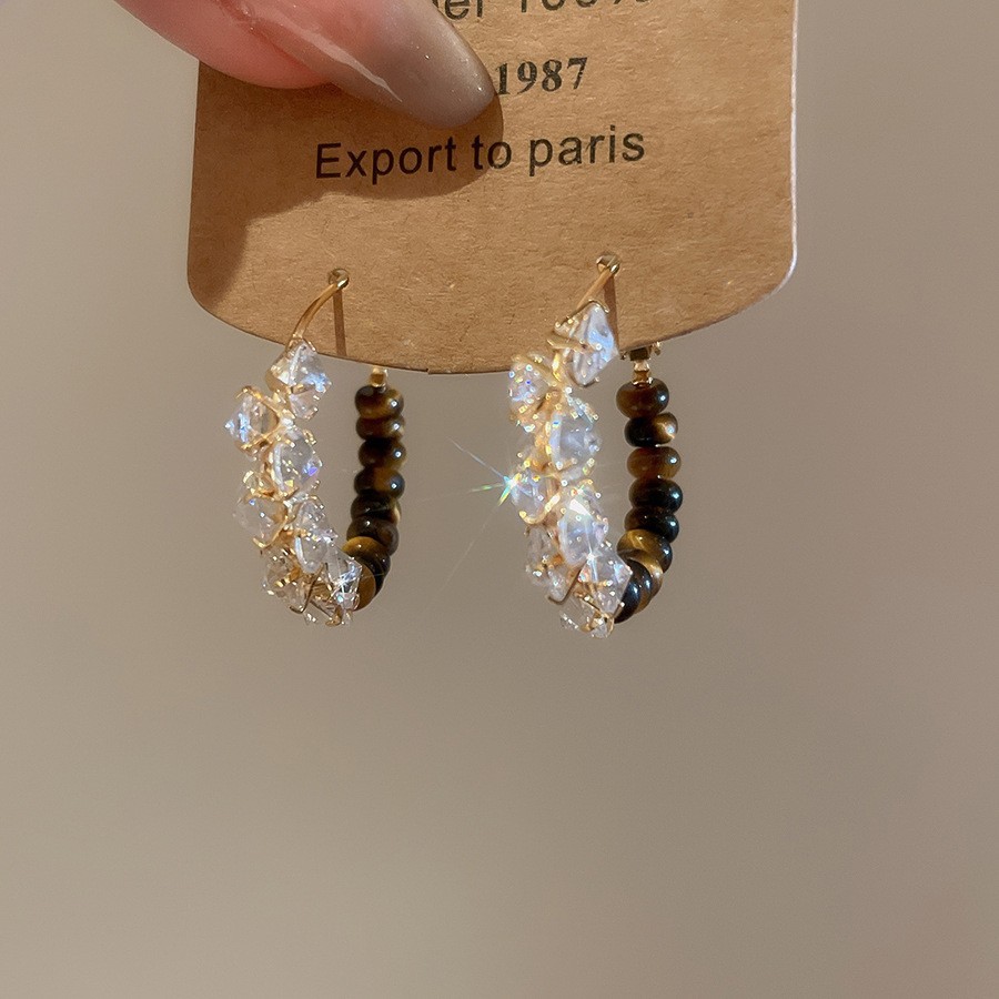 Pendientes de ojo de tigre artificial de color café Maillard con aguja de plata Pendientes simples y de moda de todo fósforo Pendientes ligeros de lujo de alta gama