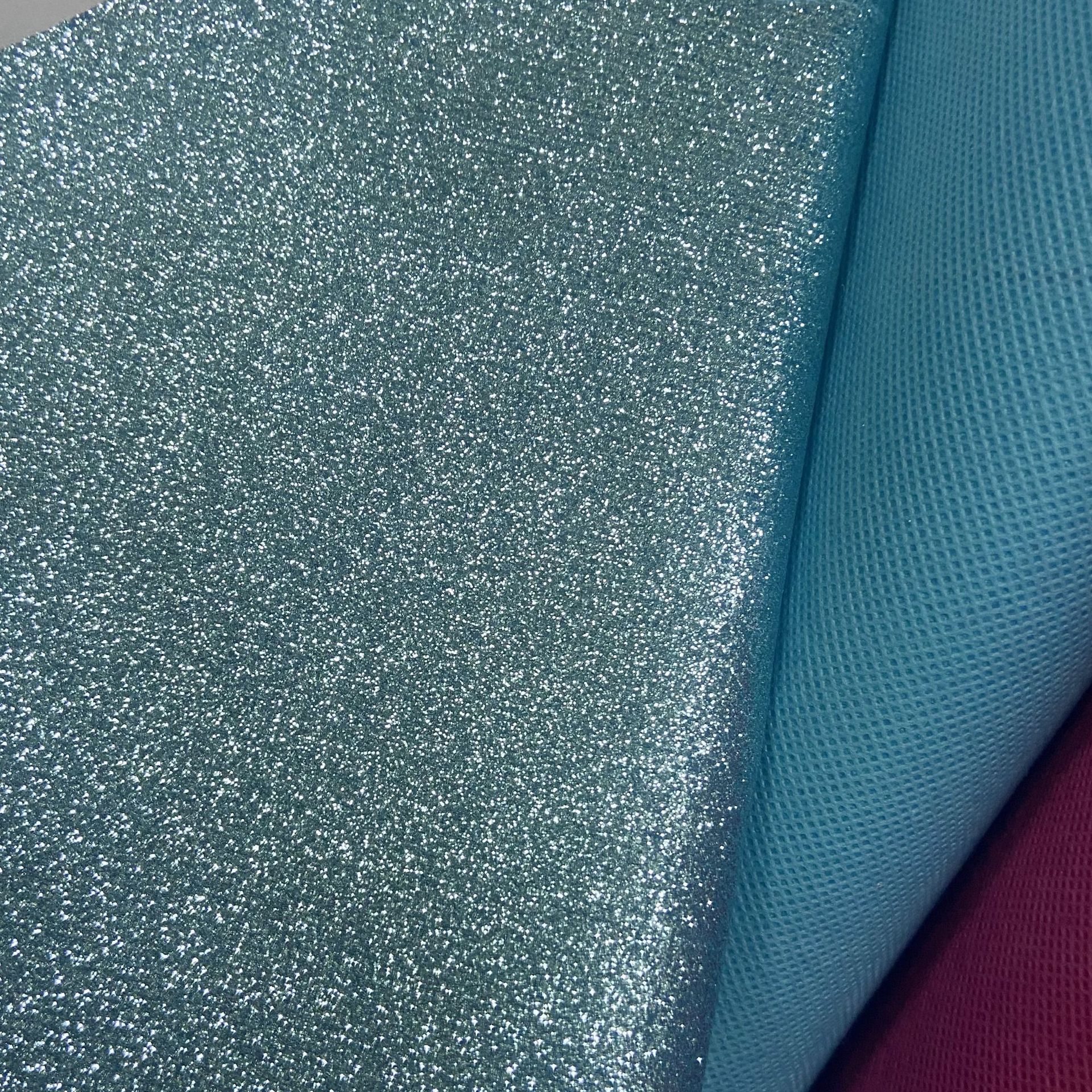 Suministro directo de fábrica de tela no tejida Glite Brillante Tela de lentejuelas Estuche para teléfono móvil Bolsa de cosméticos Accesorios para el cabello Decoración de ropa