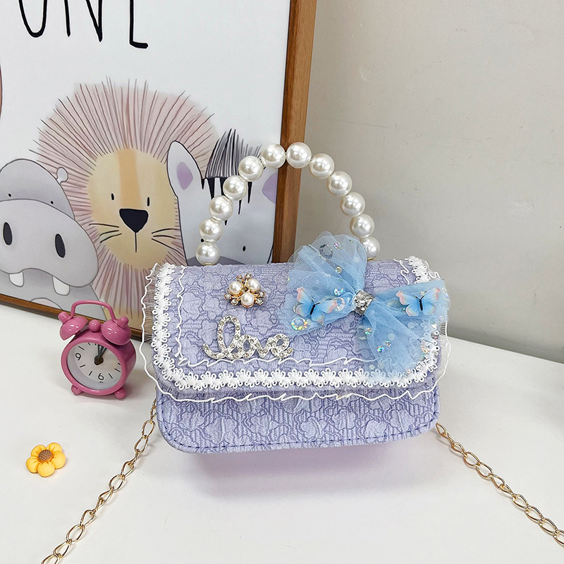 2023 nuevos niños bolsa de mensajero bolsa de moda princesa arco bolso de hombro coreano mini bolso de la cadena de la muchacha