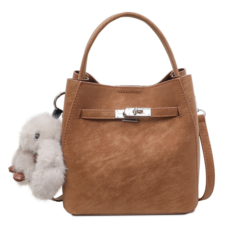 Bolso de mano de viaje retro coreano para mujeres 2025 nuevo paquete de cubo de hombro casual de alto nivel sensación de mochila versátil