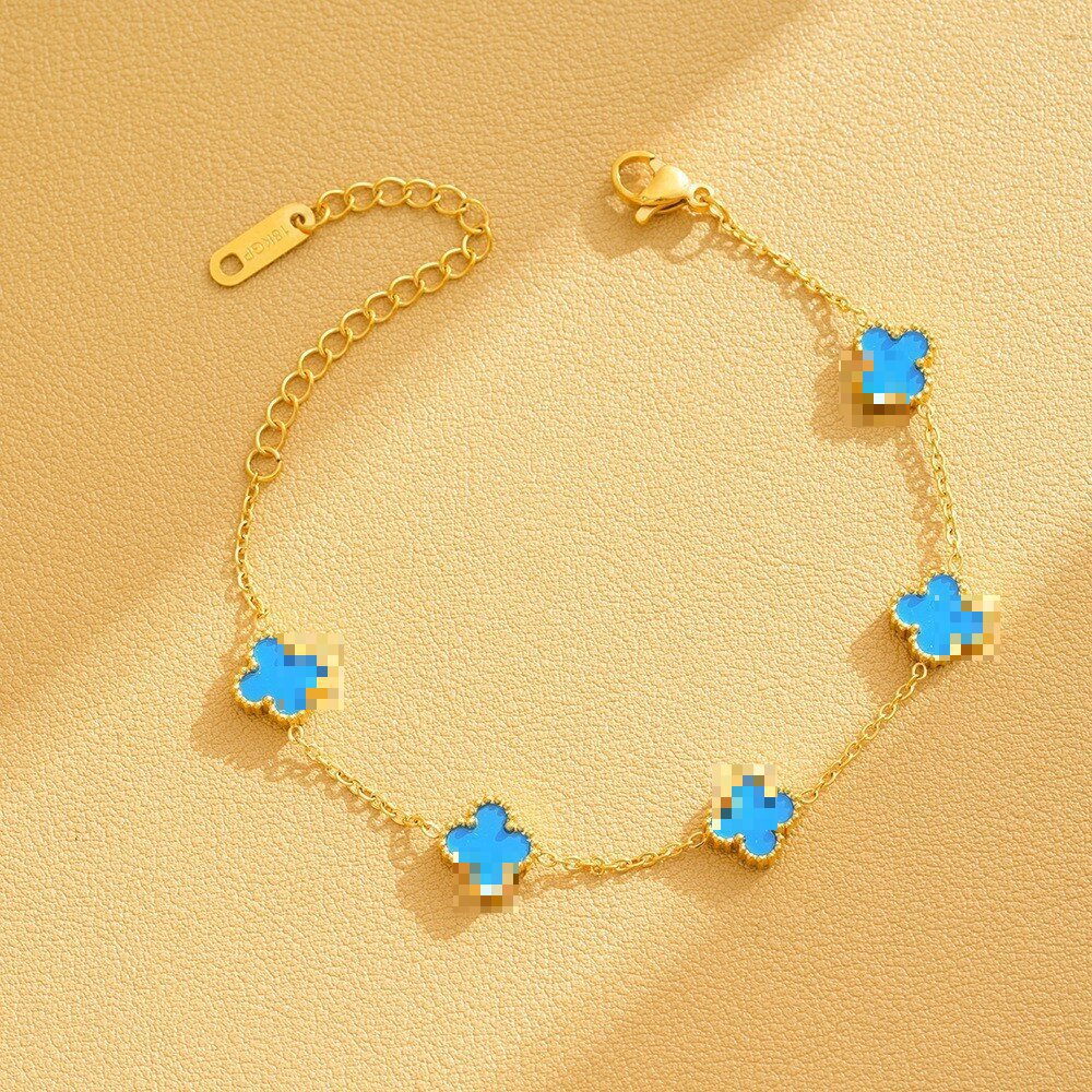 Pulsera de trébol de acero titanium vendedora caliente transfronteriza europea y americana con incrustaciones de concha pulsera colgante pulsera de diseño avanzado sin desvanecimiento al por mayor