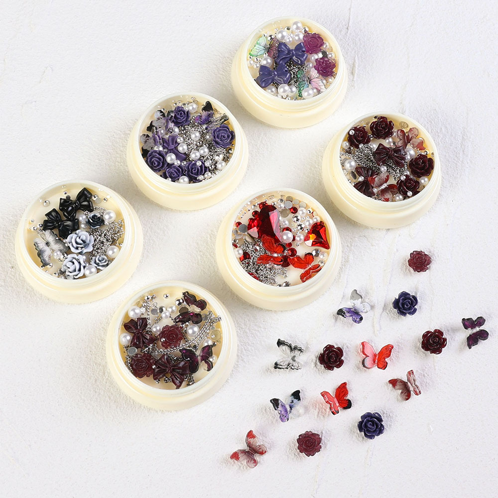 2023 nuevos accesorios de manicura camellia material paquete cadena de mariposa rosa arco mezcla combinación