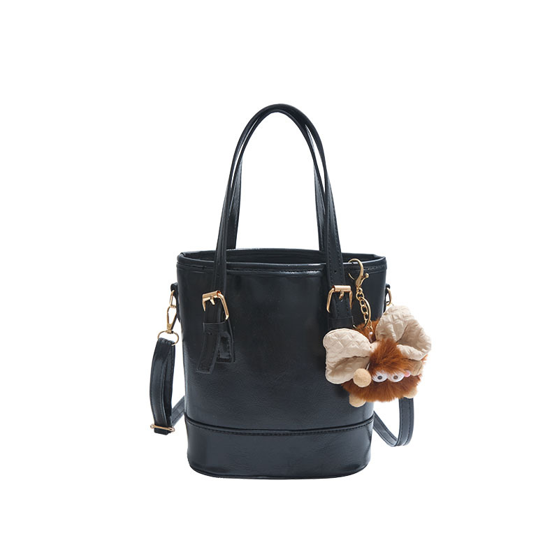 2025 nueva moda extranjera coreana bolso de cubo de mano simple ocio empalme viaje mochila de hombro para mujeres