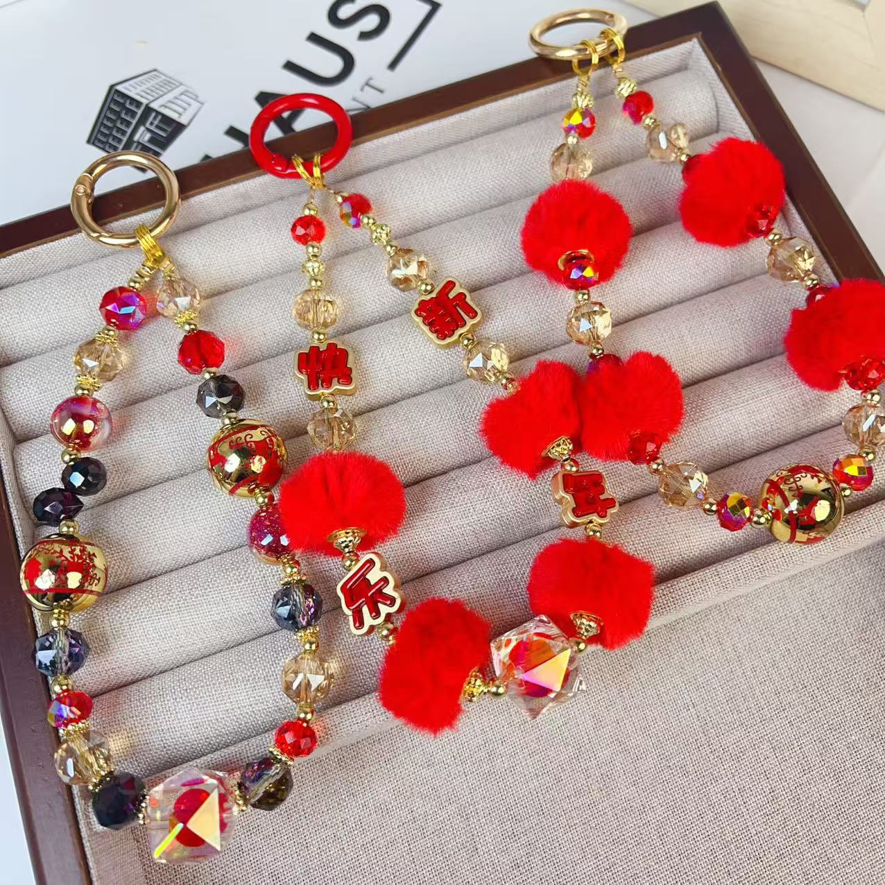 Creative New Year red atmosphere feeling fur ball beaded mobile phone chain red plush bag pendant keychain pendant wholesale