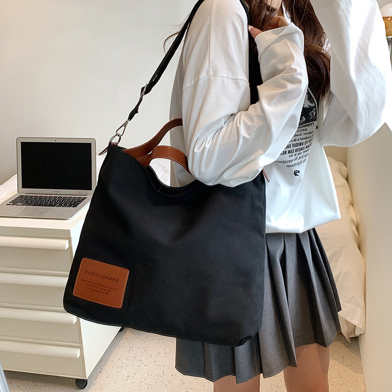 2022 nuevo estilo coreano de moda de gran capacidad bolsa de compras bolsa simple bolsa de lona bolsa de mensajero ocasional del hombro de las mujeres