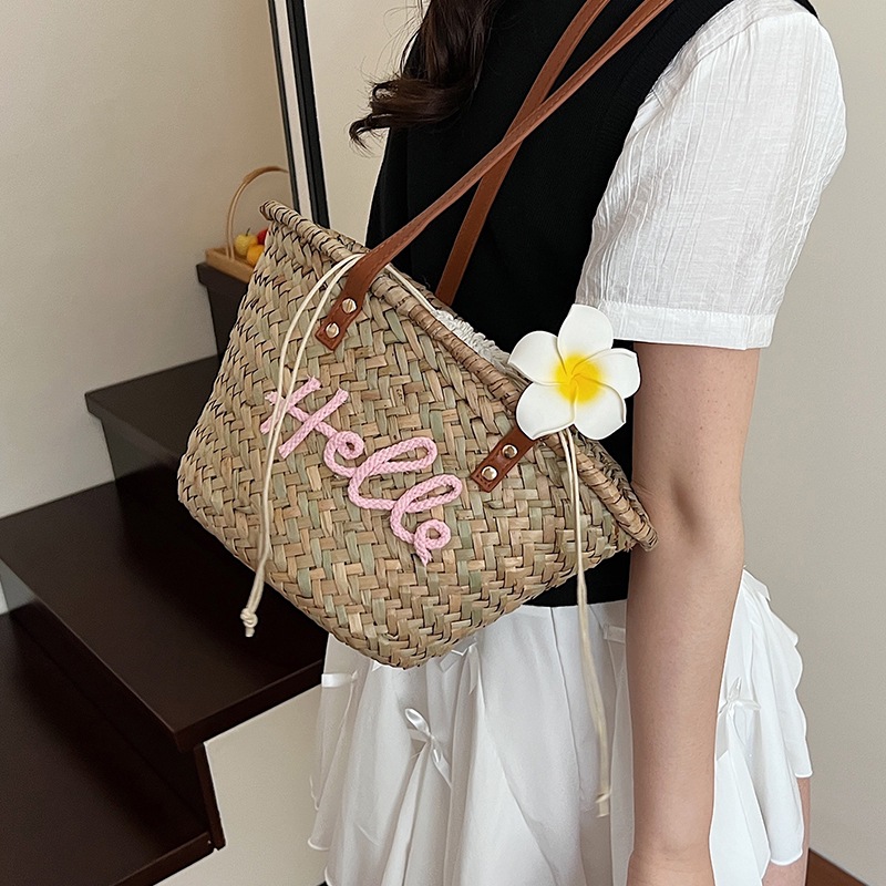 Bolso de verano para mujer, bolso versátil 2025, bolso de hombro de paja tejido sencillo para vacaciones, nuevo estilo.