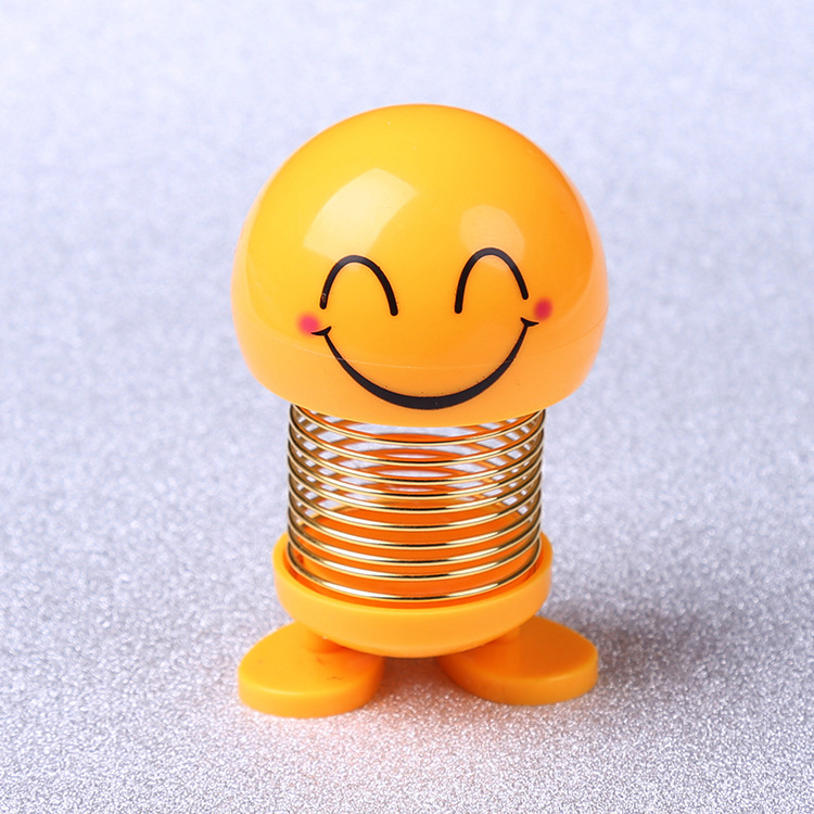 Tiktok mismo estilo sacudiendo cabeza expresión facial bolsa muñeca personalidad creativa Smiley cara coche primavera estudiante Escuela Primaria Decoración