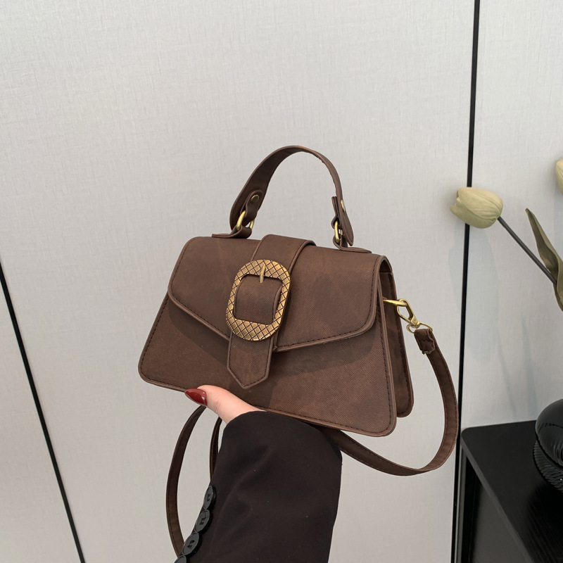 Este año popular bolso de brazo 2024 nueva moda francesa hebilla de cinturón decoración de hombro mochila retro bolso de hombro