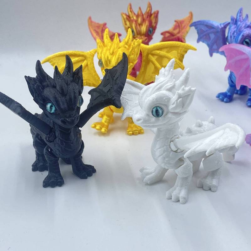 3Dプリントされたかわいい西洋のドラゴンの羽と尾は縮めたり動かしたりできる関節が付いており、子供向けのギフト、おもちゃ、モデルの装飾品です。|undefined