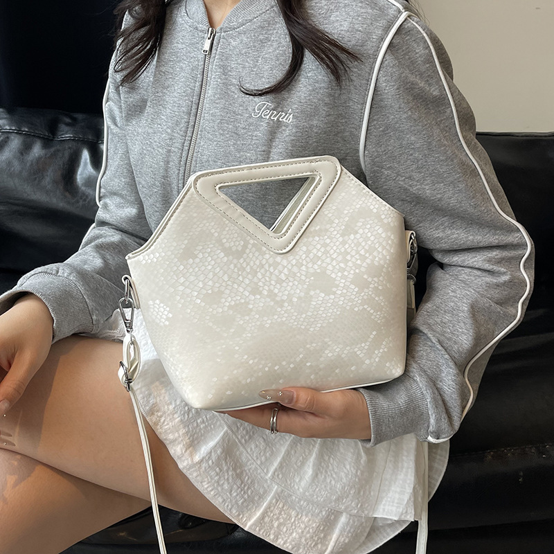 Bolso de textura transfronteriza 2025 verano nuevo estilo bolso de hombro con sentido de alta gama patrón de serpiente color contraste bolso de mensajero mujer
