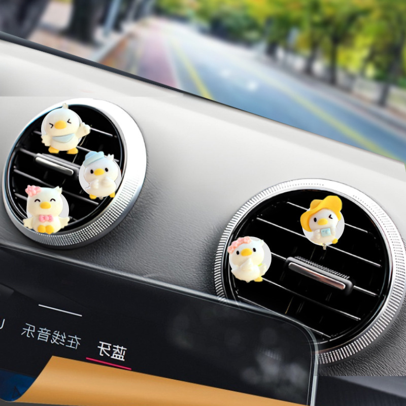 Clip de salida de aire de coche pequeño pato amarillo resina aromaterapia de coche perfume de coche adornos de dibujos animados accesorios de decoración suministros de coche