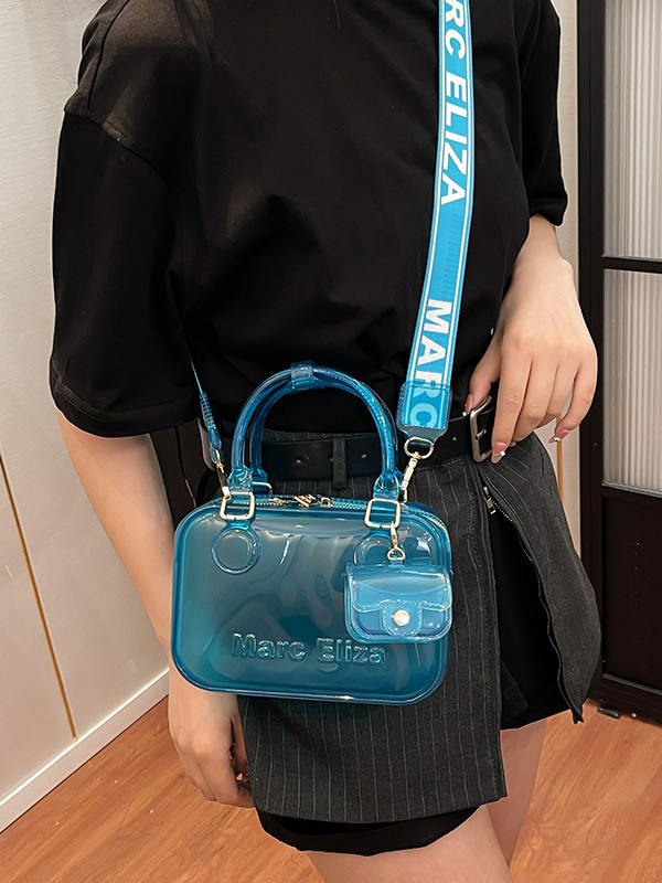 Estilo occidental transparente casual moda gelatina portátil pequeño bolso cuadrado femenino 2025 nuevo bolso bandolera de alta gama de todo fósforo