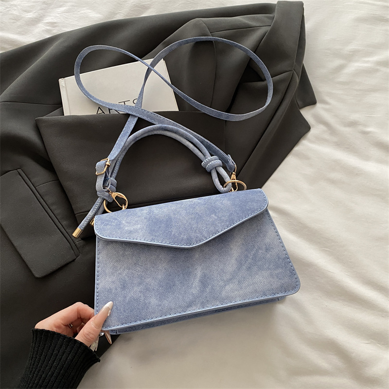 Bolso público pequeño para mujeres 2026 nuevo bolso cuadrado de alta calidad sensación de diseño retro bolso de hombro simple bolso de mano