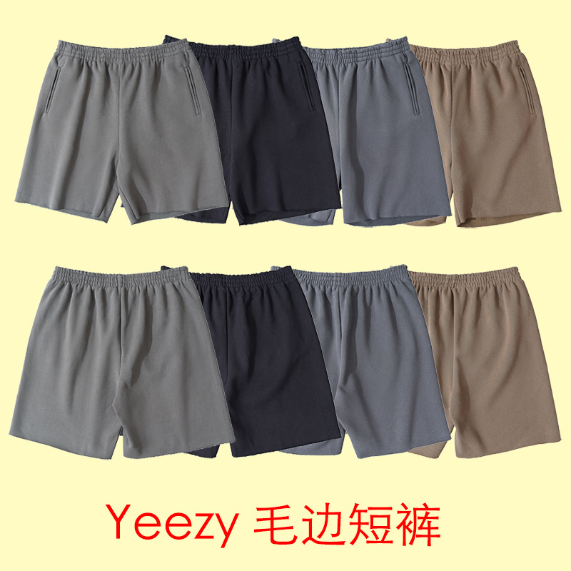 Alta versión YEEZY Kanye desgaste mismo estilo color sólido fleece-forrado High Street angustiado deshilachado pantalones cortos deportivos