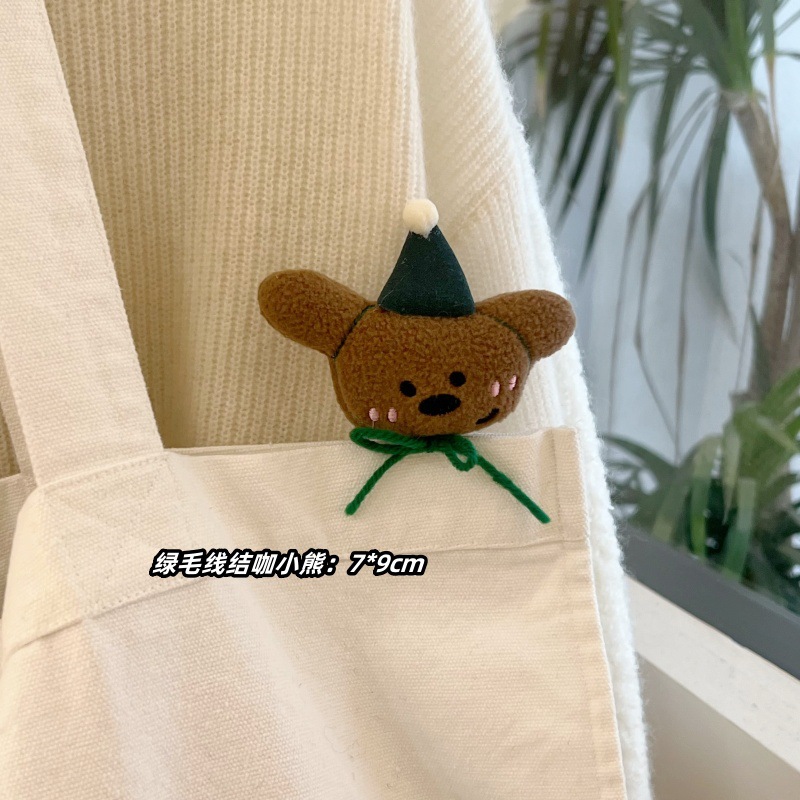 녹색 양모 매듭 곰