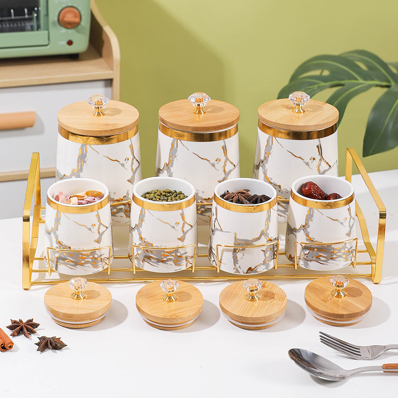 Juego de caja de condimento de comercio exterior de exportación frasco de condimento creativo con estante frasco de sellado de cerámica de lujo ligero frasco de almacenamiento de cocina