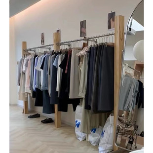 Clothing store display rack solid wood log floor-to-floor stainless steel Nakajima women's clothing store shelf display rack hanger