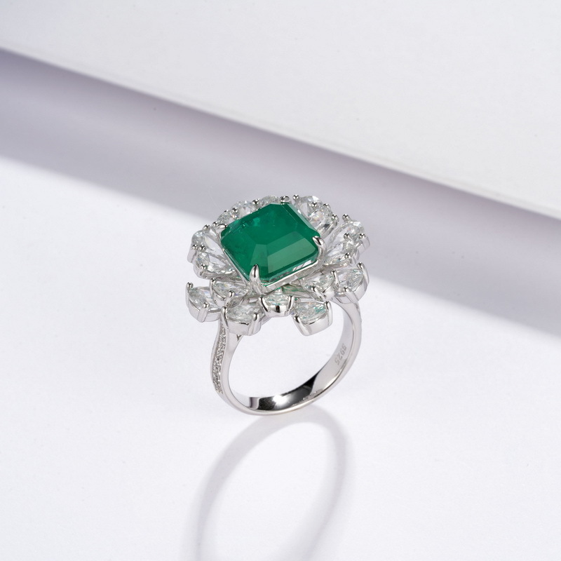 Anillo de tesoro de color de cultivo de moda atmosférica transfronteriza europea y americana S925 plata con incrustaciones de rojo y azul esmeralda Anillo de dedo de alimentación cerrado personalizado