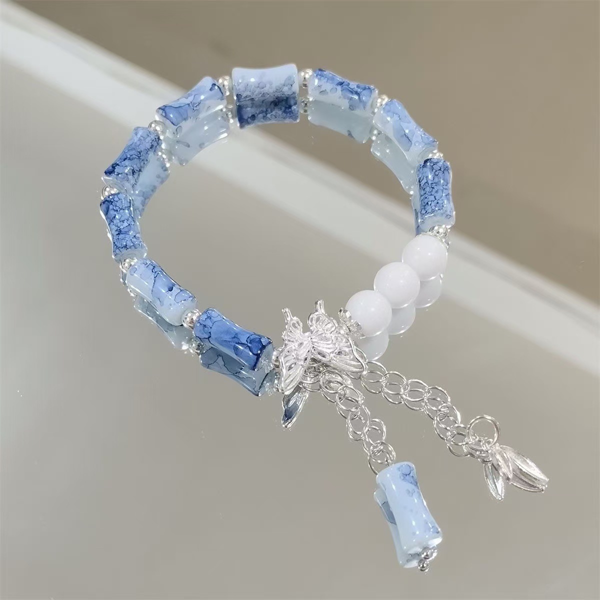 Ink blue bamboo butterfly bell bracelet