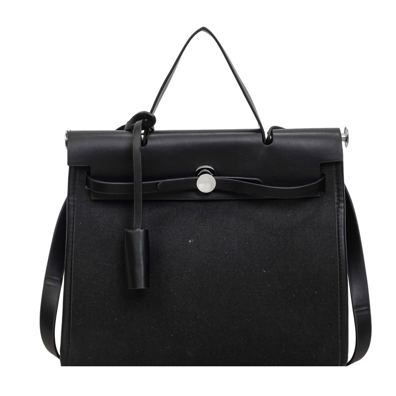 Nicho de moda portátil Kelly bolso mujer 2026 nuevo cross-border lienzo empalme color contraste viaje mochila de hombro