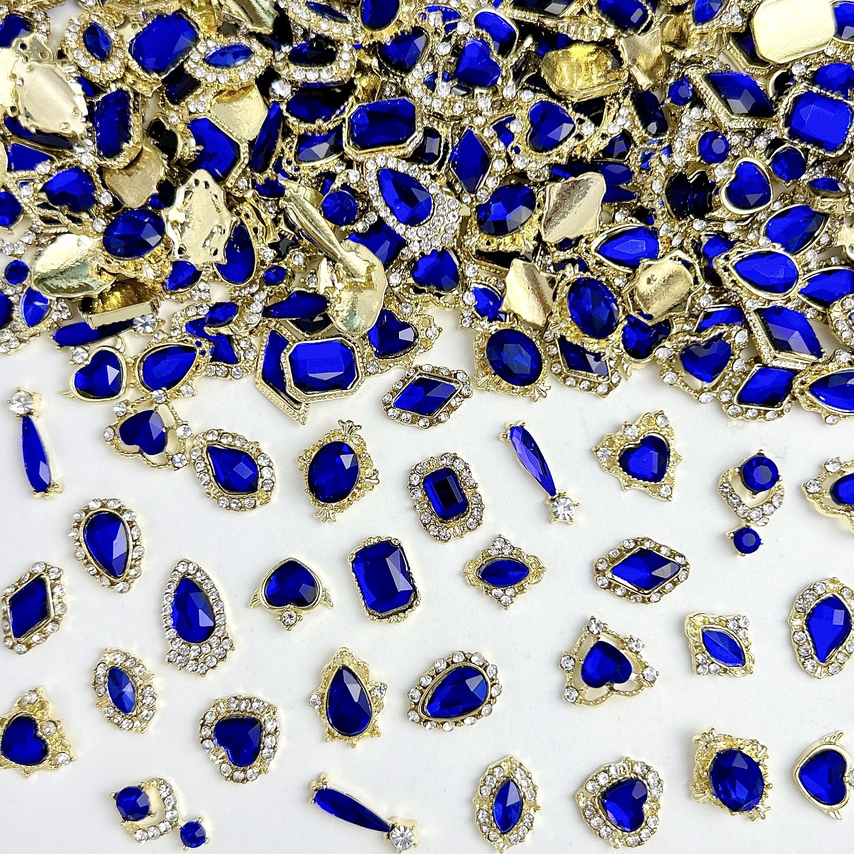 Nueva aleación china joyas de manicura taladro explosión grasa flash Fang amor gota de agua XiFeiYuan la misma armadura de la corte con taladro