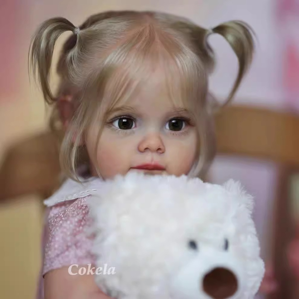 Cokela 58cm 3D simulación de alto color bebé renacido muñeca Maggi suministro transfronterizo entrega de una sola pieza