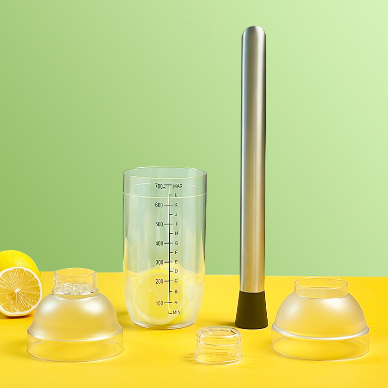 ミルクティー店のシェイクカップの調合器の目盛りのシェイクカップの手はレモンカップのツールセットを打ちます。|undefined