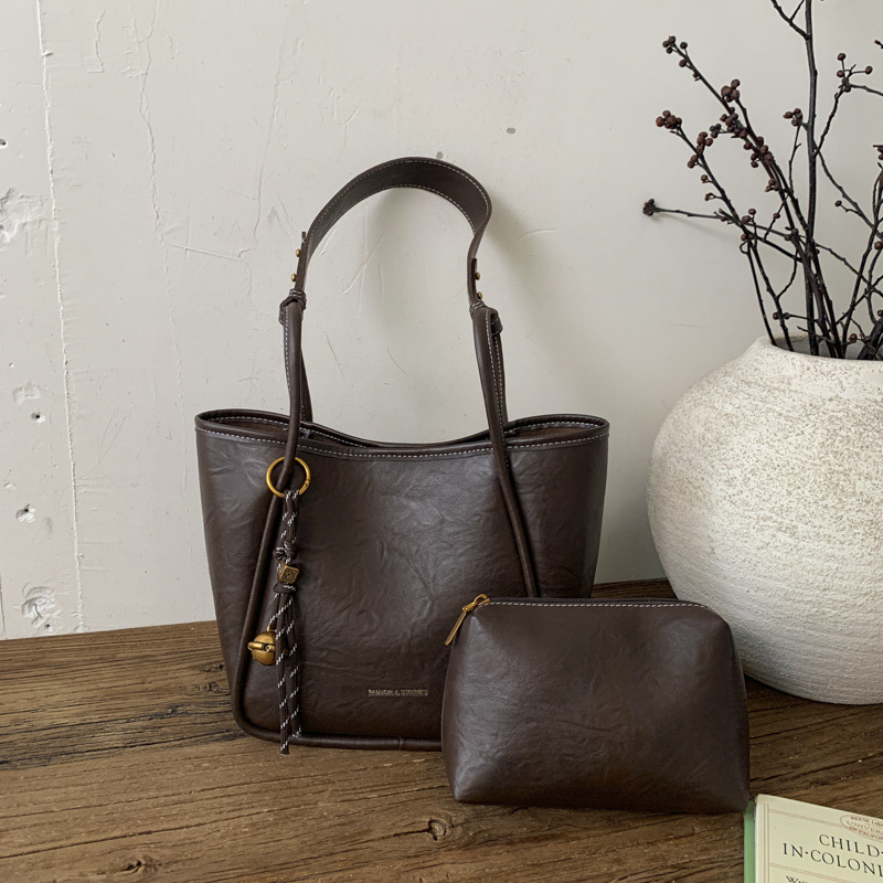 Bolso de mujer venta caliente nuevo nicho coreano bolso de cubo de alta capacidad de sensación universal bolso de moda para niños bolso de hombro