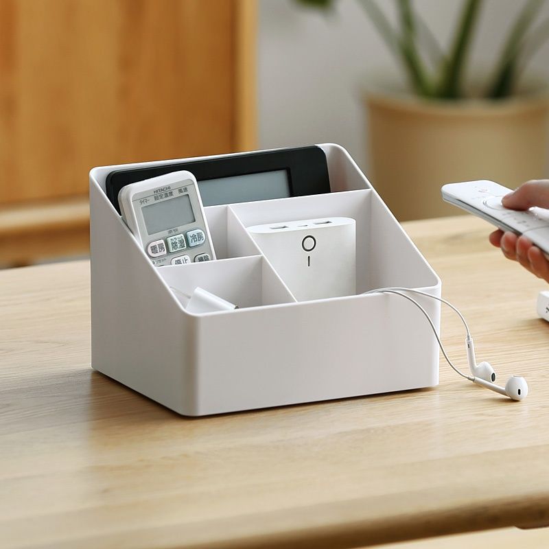 La Sala de estar del dormitorio de la esquina perezosa tiene una caja de almacenamiento de escritorio de oficina de plástico multifuncional y una caja de almacenamiento de cosméticos.