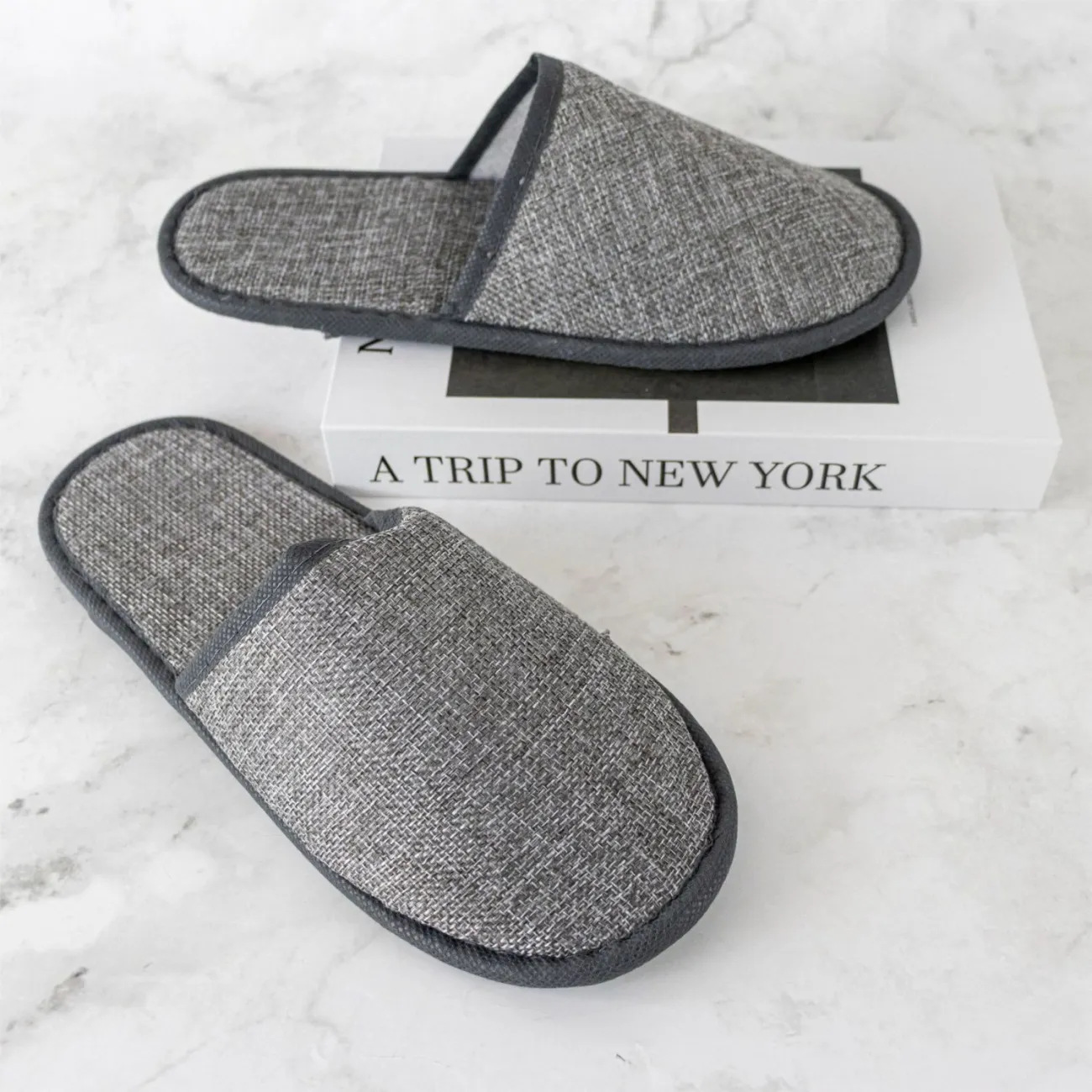 Zapatillas desechables antideslizantes suministros de hotel de hotel de alojamiento residencial para acogida de huéspedes espesar no tejido fábrica al por mayor spot