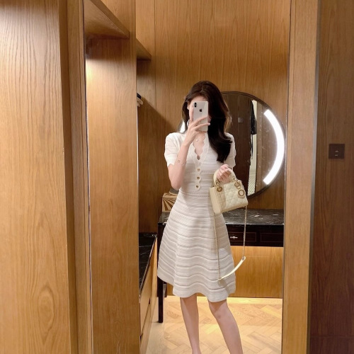 Elegant Sheath Hollowed-Out Ice Silk Dress for 2025 Summer: Wavy V-Neck, Slimming, and Body-Sculpting Knitted Skirt for Women