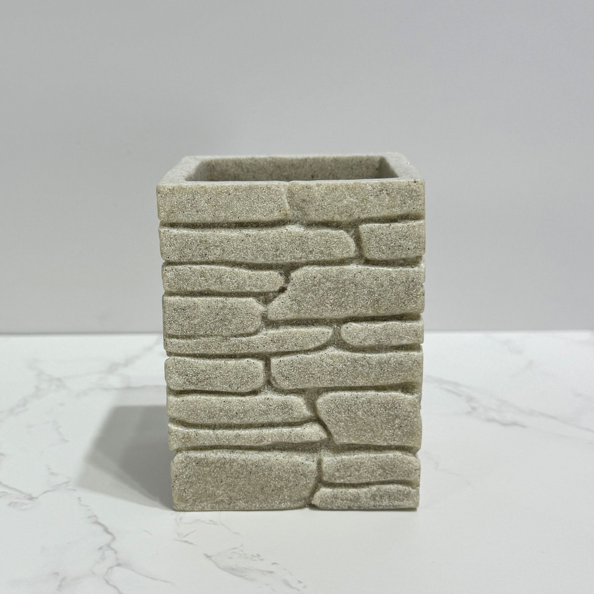 Imitación de diseño de arena y grava, baño de cuatro piezas, juego de decoración de baño de hotel de estilo europeo, botella de desinfectante de manos transfronterizo