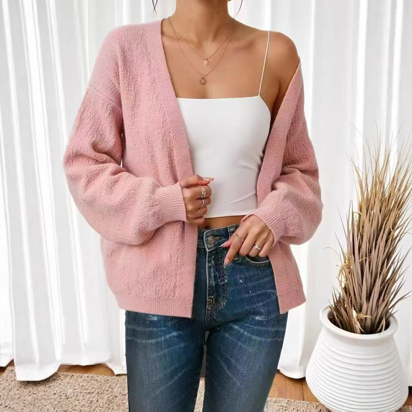 Estación independiente Amazonas temperamento de color sólido de punto de mujer otoño y invierno 2025 nuevo estilo de linterna manga suéter suelto chaqueta mujer