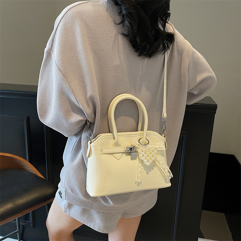 Bolso de concha de moda de verano transfronterizo para mujer 2025 nuevo bolso de hombro de estilo occidental de todo fósforo bolso de mensajero de moda de alta gama