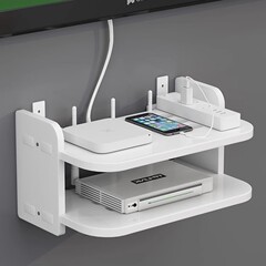 ルータの物置棚の壁のお客さんのテレビのセットトップボックスの寝室はwifiの収納箱の棚を置いて穴を開けないで壁掛けにします。