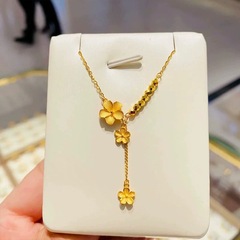 ゴールドストアと同じスタイルのサンドゴールドタッセルピーチネックレス女性用新しい古代スタイルの絶妙な小さな金の花鎖骨チェーンドロップシッピング