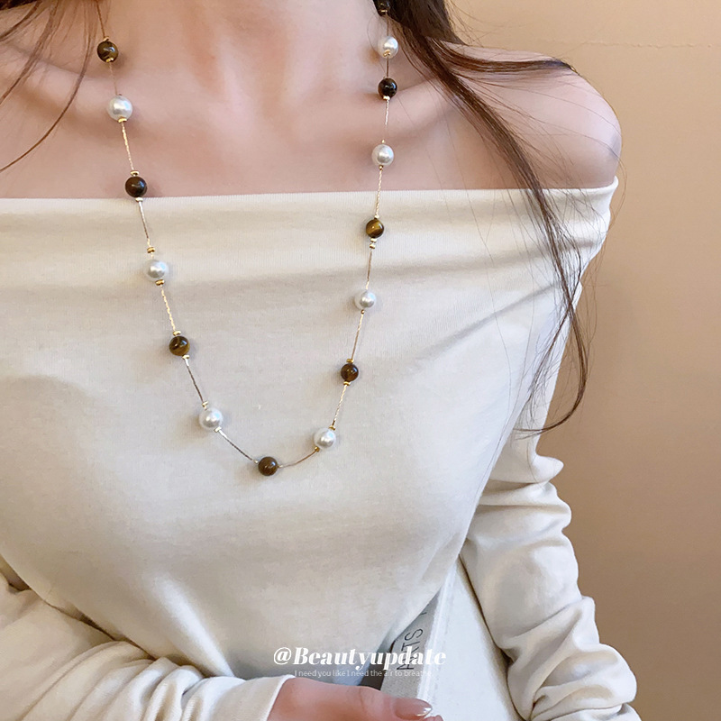 Collar de perlas de piedra de ojo de tigre artificial transfronterizo otoño e invierno cadena de suéter de todo fósforo de nicho accesorios de joyería de moda de alta gama