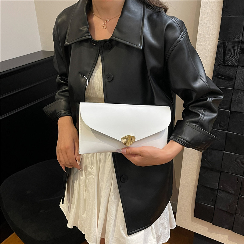 Commuting coreano ins alta sensación bolso de cena de moda casual nicho de diseño de color sólido bolso de mano universal