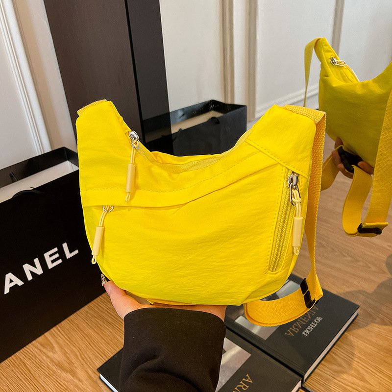 Bolsa de hombro deportiva casual coreana para hombres y mujeres, bolsas de bolsas de bolsas para niños de color sólido.