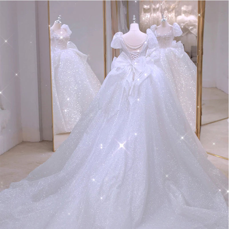 Vestido de novia estilo 2026 con diseño de cielo estrellado, cola estilo francés, mangas abullonadas blancas que cubren los brazos, elegante y grandioso. image 7