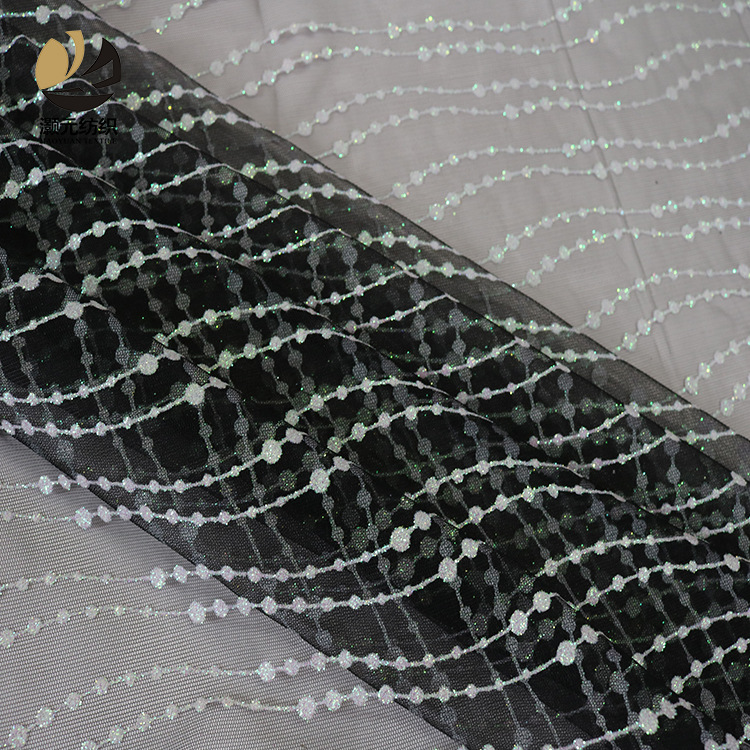 Fabricantes de venta de bajo precio ondulado fantasía polvo brillante tela de malla vestido de noche tela de boda