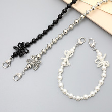 创意新款珍珠蝴蝶结手机挂件手机壳钥匙扣挂饰双扣手提链手机挂绳