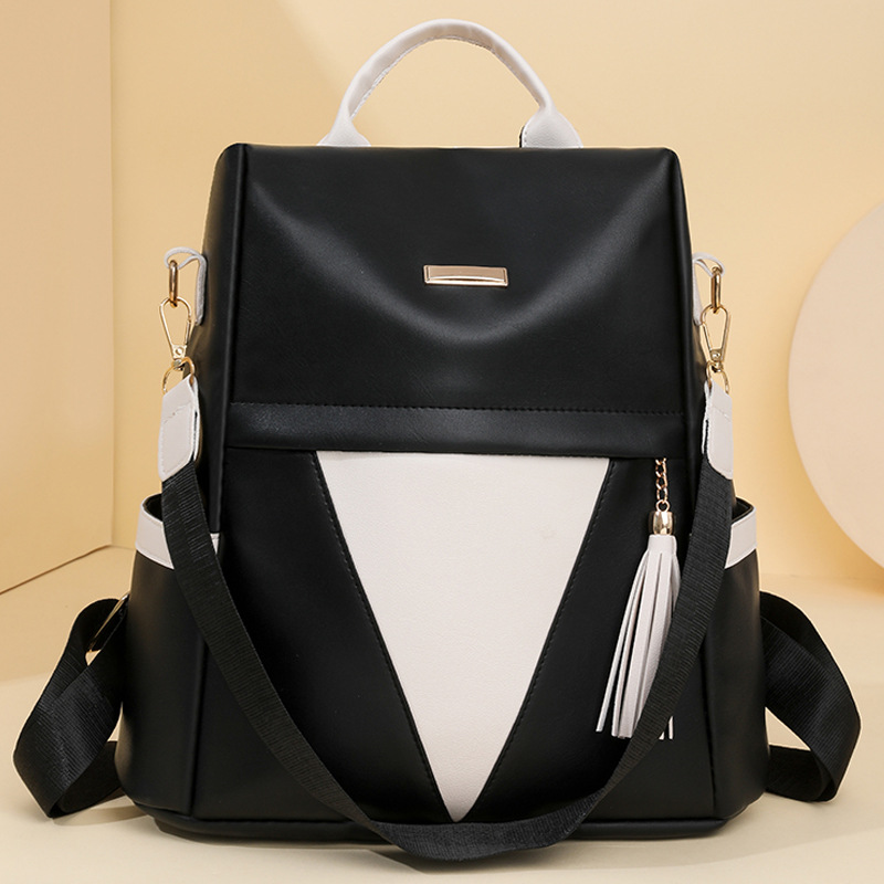 Mochila antirrobo para mujer 2024 nueva moda en contraste color mochila de cercanías de gran capacidad para mujer mochila con borlas multifuncional