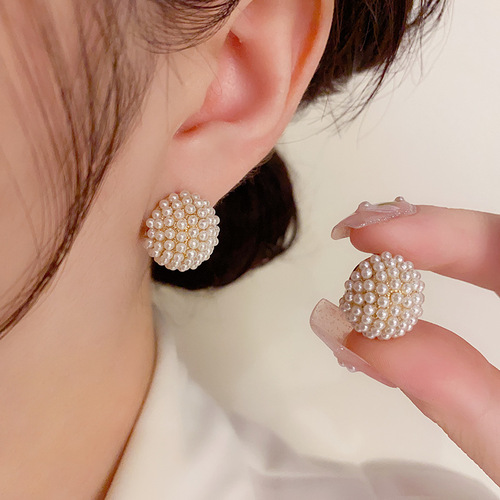 The same stylish and elegant pearl hoop earrings with a unique design, fashionable, cute, and a high-end vibe.