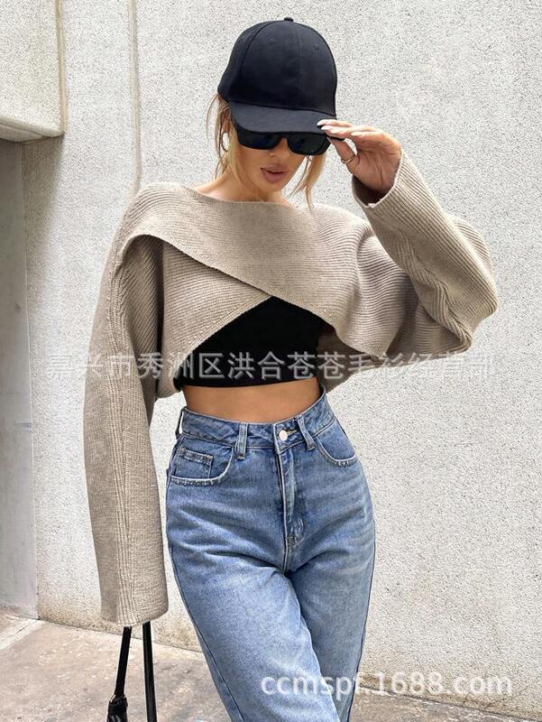 2023秋冬の新型日韓の不規則なニットのセーターの女性のデザイン感の小さい大衆の交差するニットの大きいサイズの婦人服|undefined