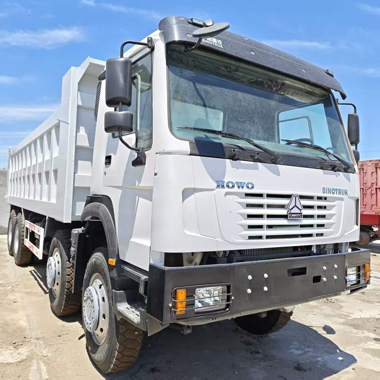 Current Stock for Export: Howo Dump Truck 8X4 Earthmoving Transport Tipper Truck, Heavy-Duty Dump Truck, Earthmoving Truck Parts