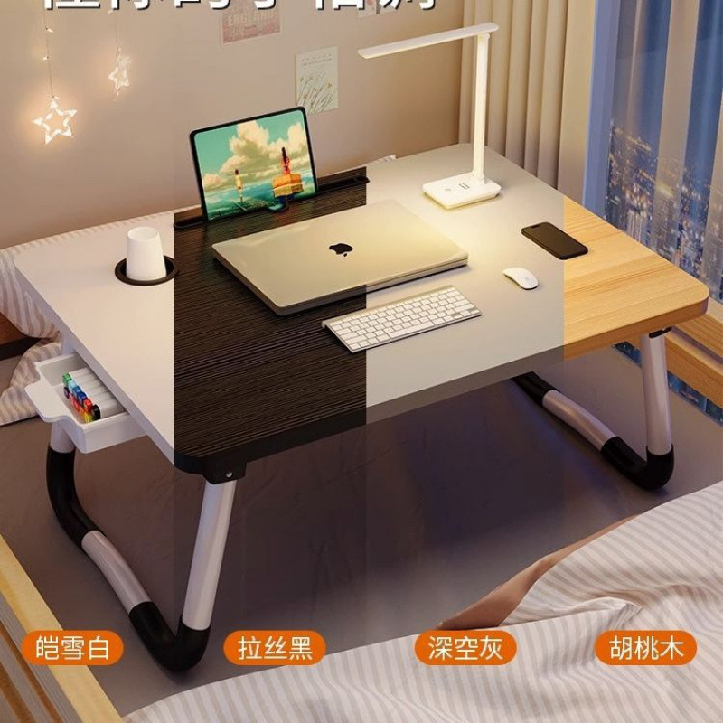 折り畳み式のベッドの上の小さい机のコンピュータの机の学生の寮の上で学習の机を敷きます。|undefined