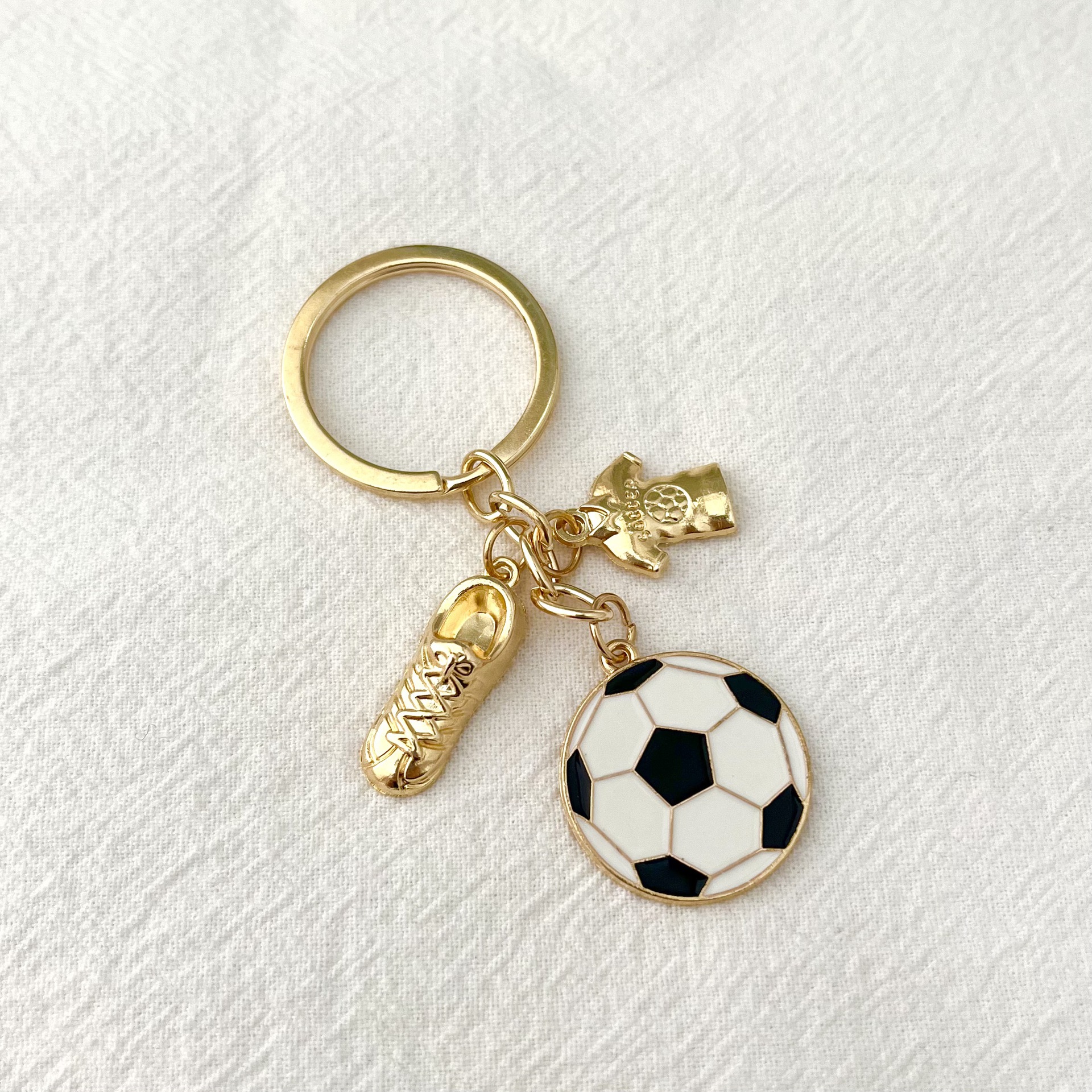 Serie de oro de aleación de venta transfronteriza caliente fútbol béisbol rugby sombrero hechicero puño llavero colgante mochila