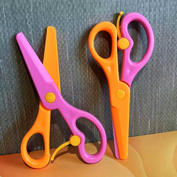 Pink and orange scissors